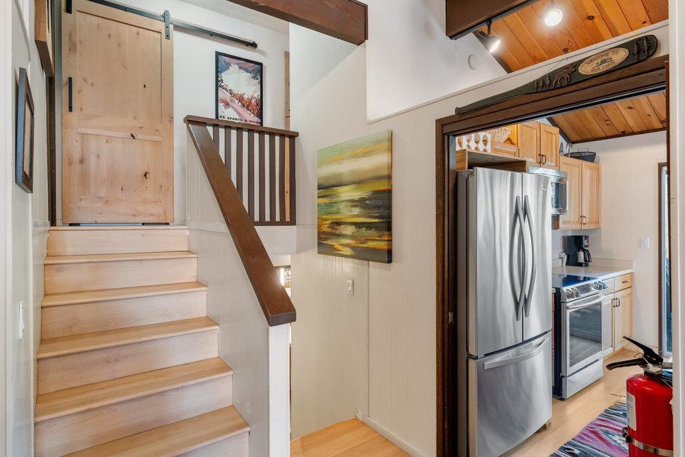 5659 Rhodesia Road Carnelian Bay, CA 96140 - Photo 14 of 28 a view of entryway with wooden floor and stairs
