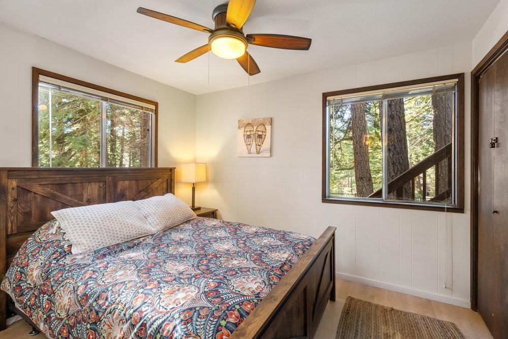 5659 Rhodesia Road Carnelian Bay, CA 96140 - Photo 15 of 28 a bedroom with a bed and a window