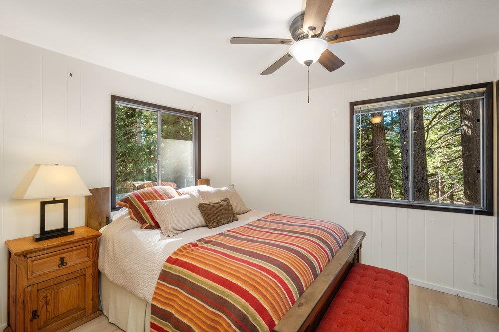 5659 Rhodesia Road Carnelian Bay, CA 96140 - Photo 20 of 28 a bedroom with bed and a window