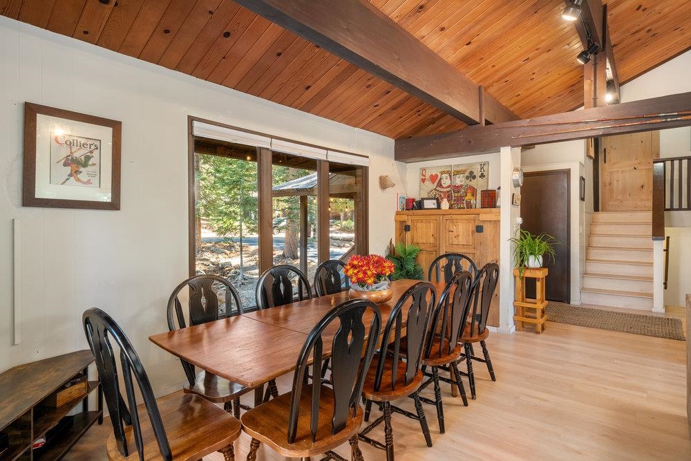 5659 Rhodesia Road Carnelian Bay, CA 96140 - Photo 6 of 28 a view of a dining room with furniture window and wooden floor
