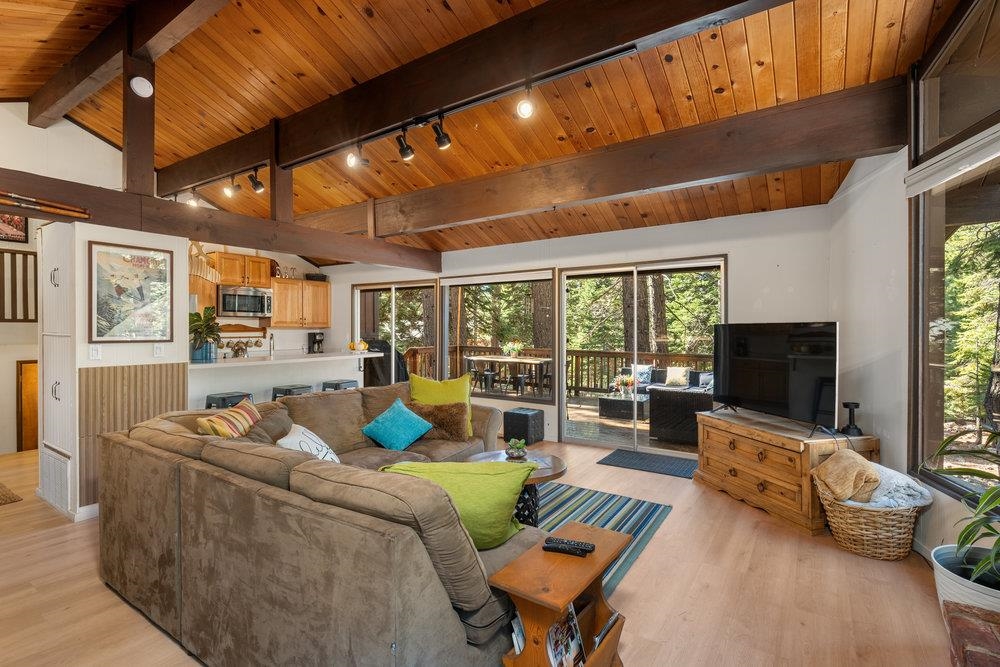 5659 Rhodesia Road Carnelian Bay, CA 96140 - Photo 7 of 28 a living room with furniture and a flat screen tv