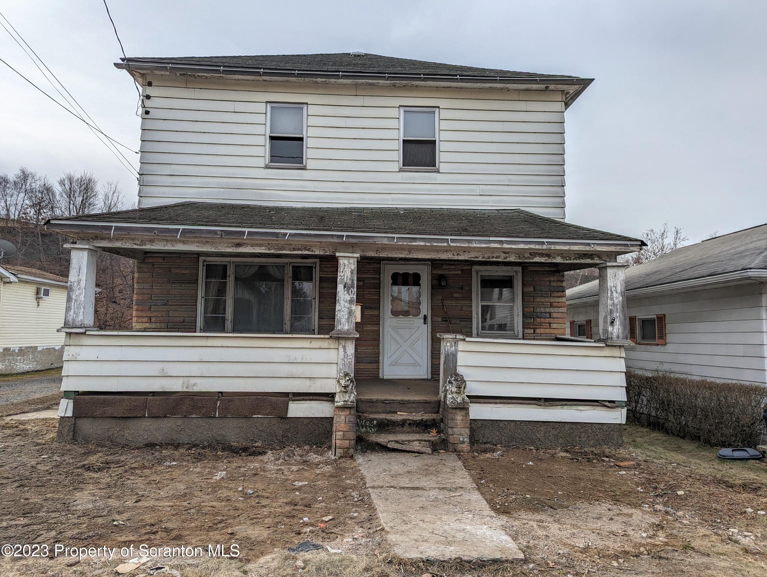 a view of white house with large windows