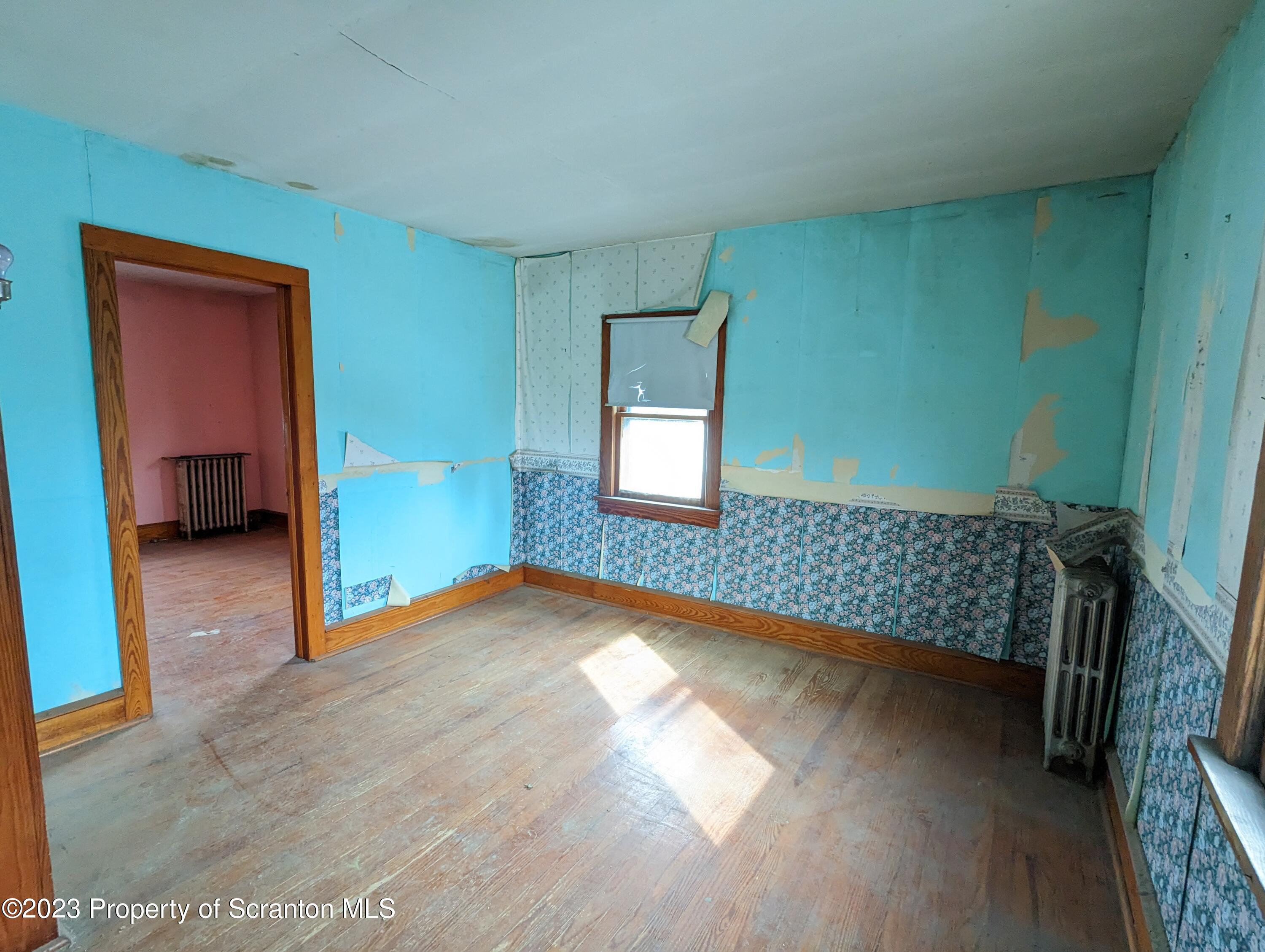 710 Edgebrook Drive Moosic, PA 18507 - Photo 14 of 19 a view of empty room with wooden floor and fan