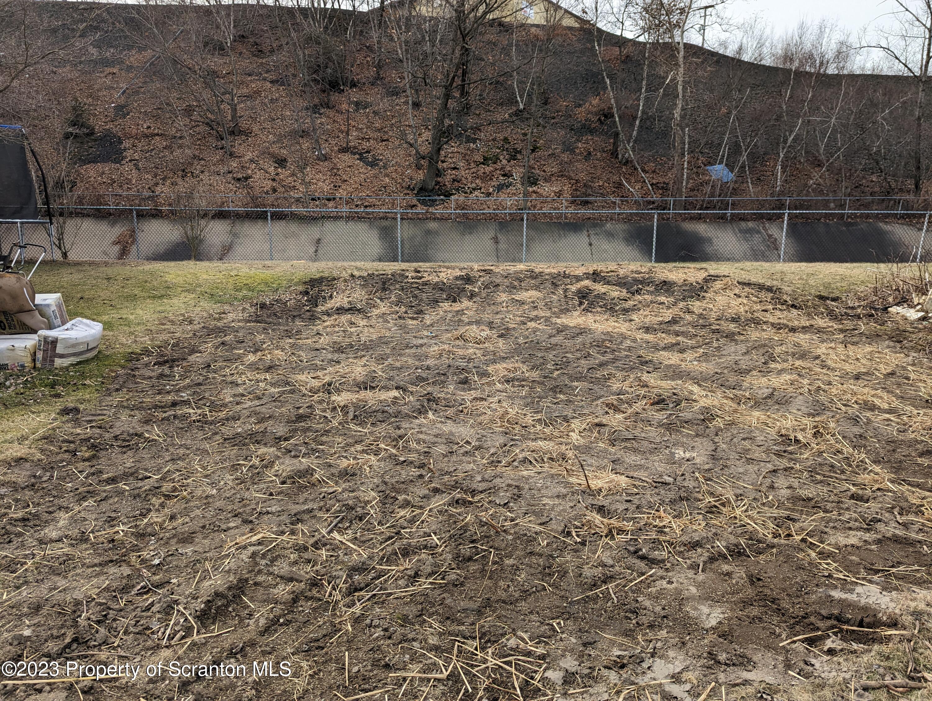 710 Edgebrook Drive Moosic, PA 18507 - Photo 18 of 19 a view of lake with a bench