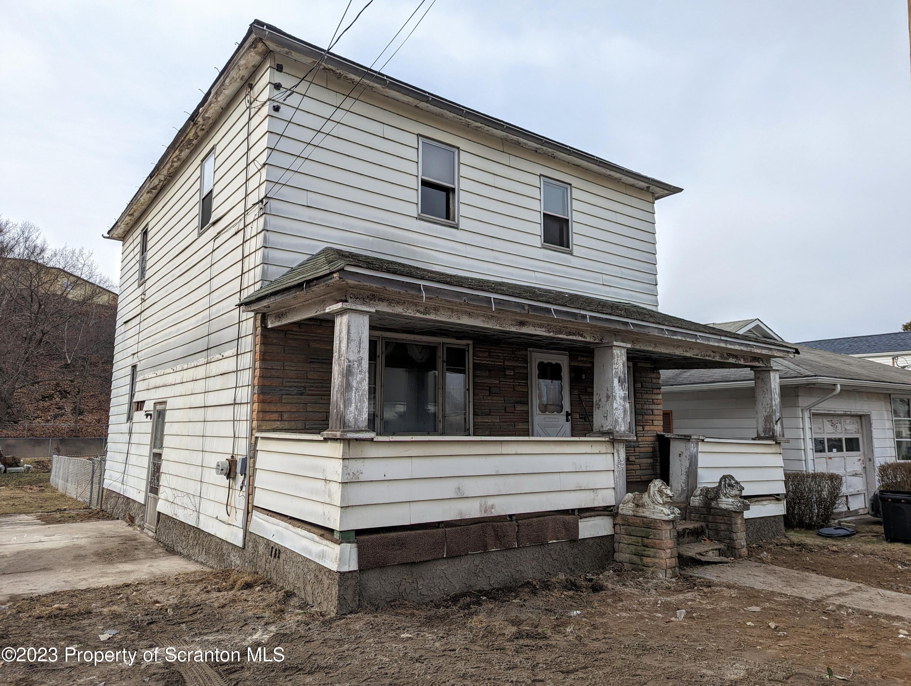 710 Edgebrook Drive Moosic, PA 18507 - Photo 2 of 19 a view of a white house with large windows