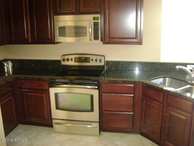 3935 East Rough Rider Road, Unit 1198 Phoenix, AZ 85050 - Photo 1 of 23 KITCHEN