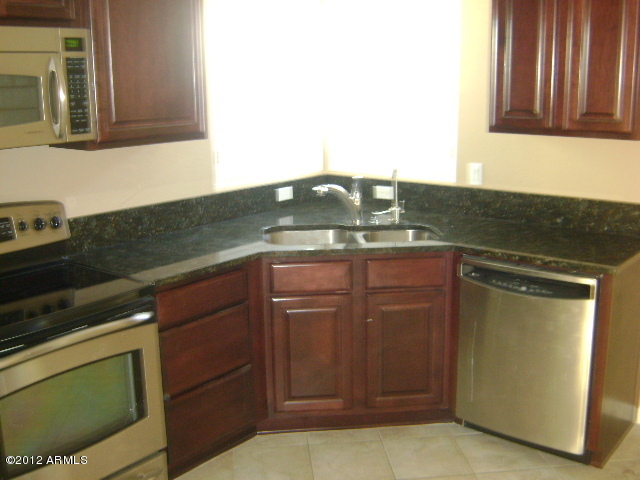 3935 East Rough Rider Road, Unit 1198 Phoenix, AZ 85050 - Photo 15 of 23 KITCHEN