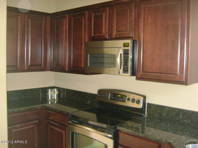 3935 East Rough Rider Road, Unit 1198 Phoenix, AZ 85050 - Photo 16 of 23 KITCHEN