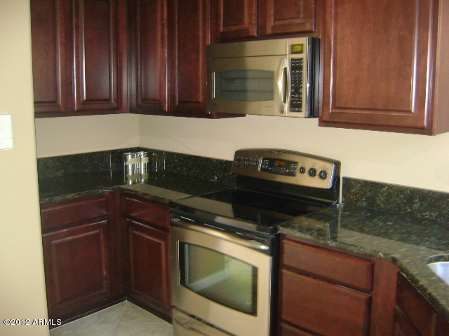 3935 East Rough Rider Road, Unit 1198 Phoenix, AZ 85050 - Photo 2 of 23 KITCHEN