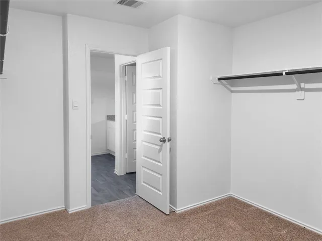 a view of a hallway with closet area