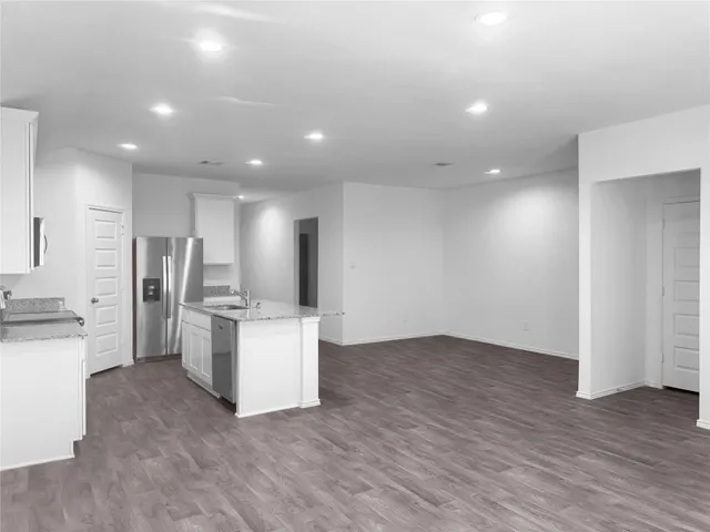 a view of kitchen with wooden floor
