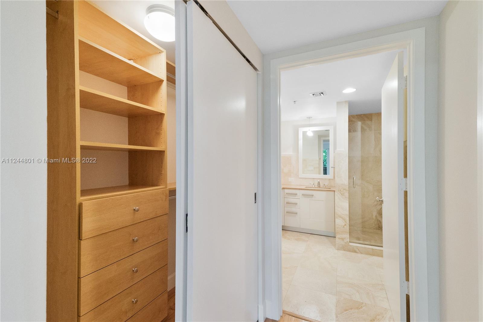 3540 Main Highway, Unit 309 Miami, FL 33133 - Photo 21 of 34 a view of walk in closet with empty racks