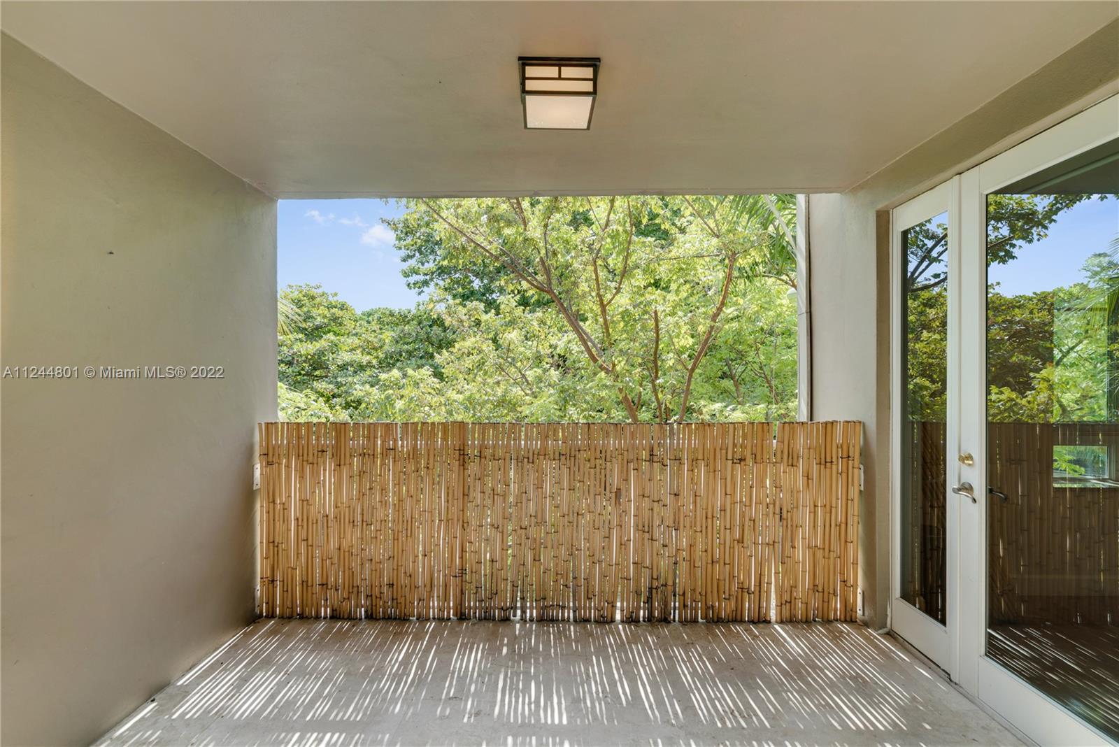 3540 Main Highway, Unit 309 Miami, FL 33133 - Photo 27 of 34 a view of a house with a balcony