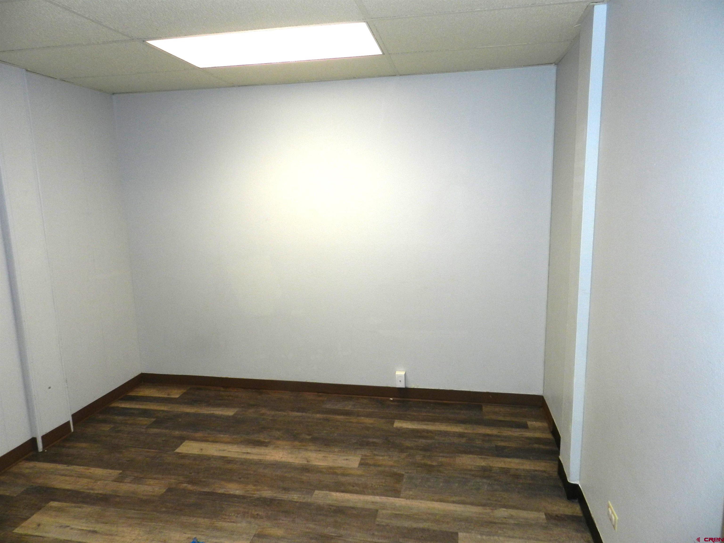 18 North Uncompahgre Avenue, Unit BACK SECTION OF 501 E MAIN BUILDING Montrose, CO 81401 - Photo 12 of 24 a view of room with wooden floor