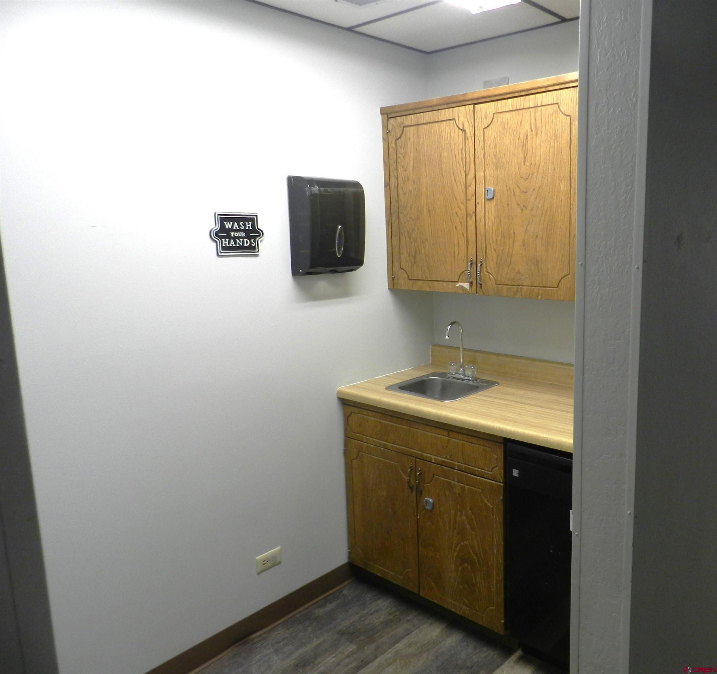 18 North Uncompahgre Avenue, Unit BACK SECTION OF 501 E MAIN BUILDING Montrose, CO 81401 - Photo 6 of 24 a bathroom with a sink and a mirror