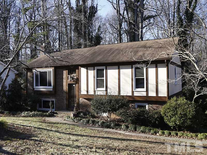 7209 Fiesta Way Raleigh, NC 27615 - Photo 1 of 24 a front view of a house with trees
