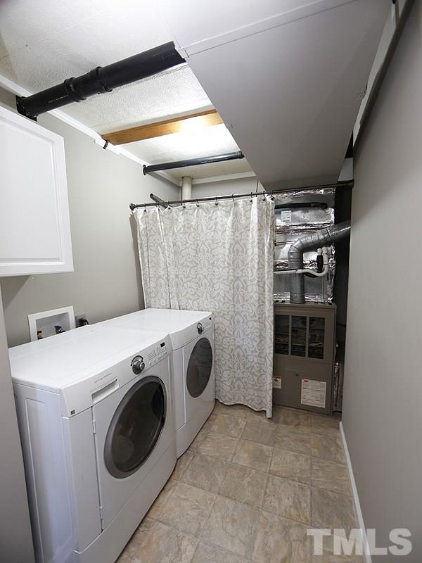 7209 Fiesta Way Raleigh, NC 27615 - Photo 19 of 24 a utility room with dryer and washer