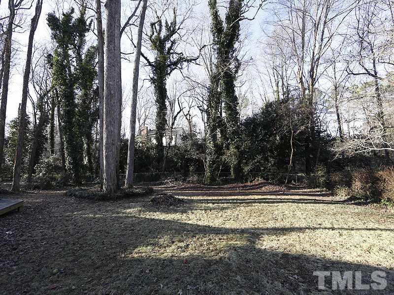 7209 Fiesta Way Raleigh, NC 27615 - Photo 23 of 24 a view of a yard with large trees