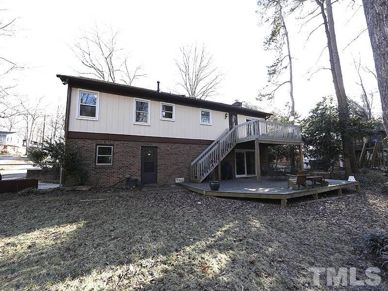 7209 Fiesta Way Raleigh, NC 27615 - Photo 24 of 24 a front view of a house with garden