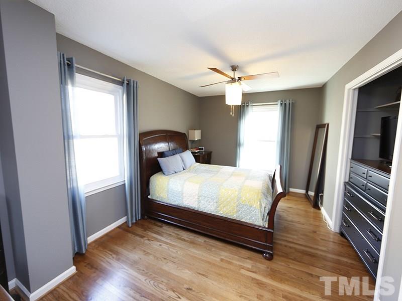 7209 Fiesta Way Raleigh, NC 27615 - Photo 4 of 24 a bedroom with a bed and a large window