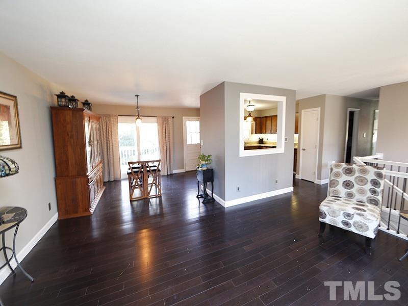 7209 Fiesta Way Raleigh, NC 27615 - Photo 7 of 24 a view of a livingroom with furniture hardwood floor and a living room