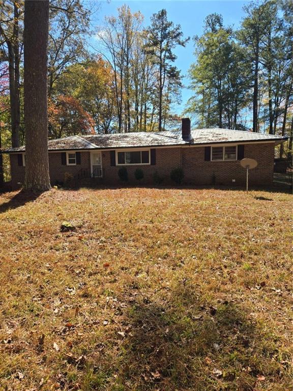735 Seabreeze Lake Road Buchanan, GA 30113 - Photo 2 of 13 a view of backyard with swimming pool and seating