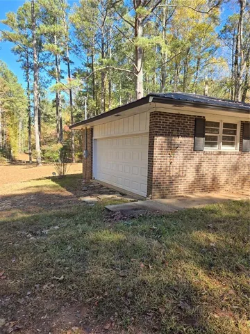 a bathroom with a toilet and a bathtub