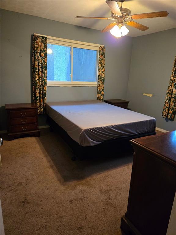 735 Seabreeze Lake Road Buchanan, GA 30113 - Photo 9 of 9 a bed sitting in a room next to a window