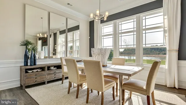 a dining room with furniture window wooden floor