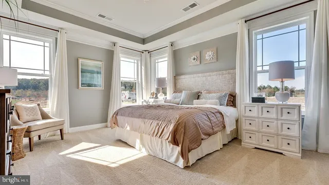a spacious bedroom with a bed and a couch