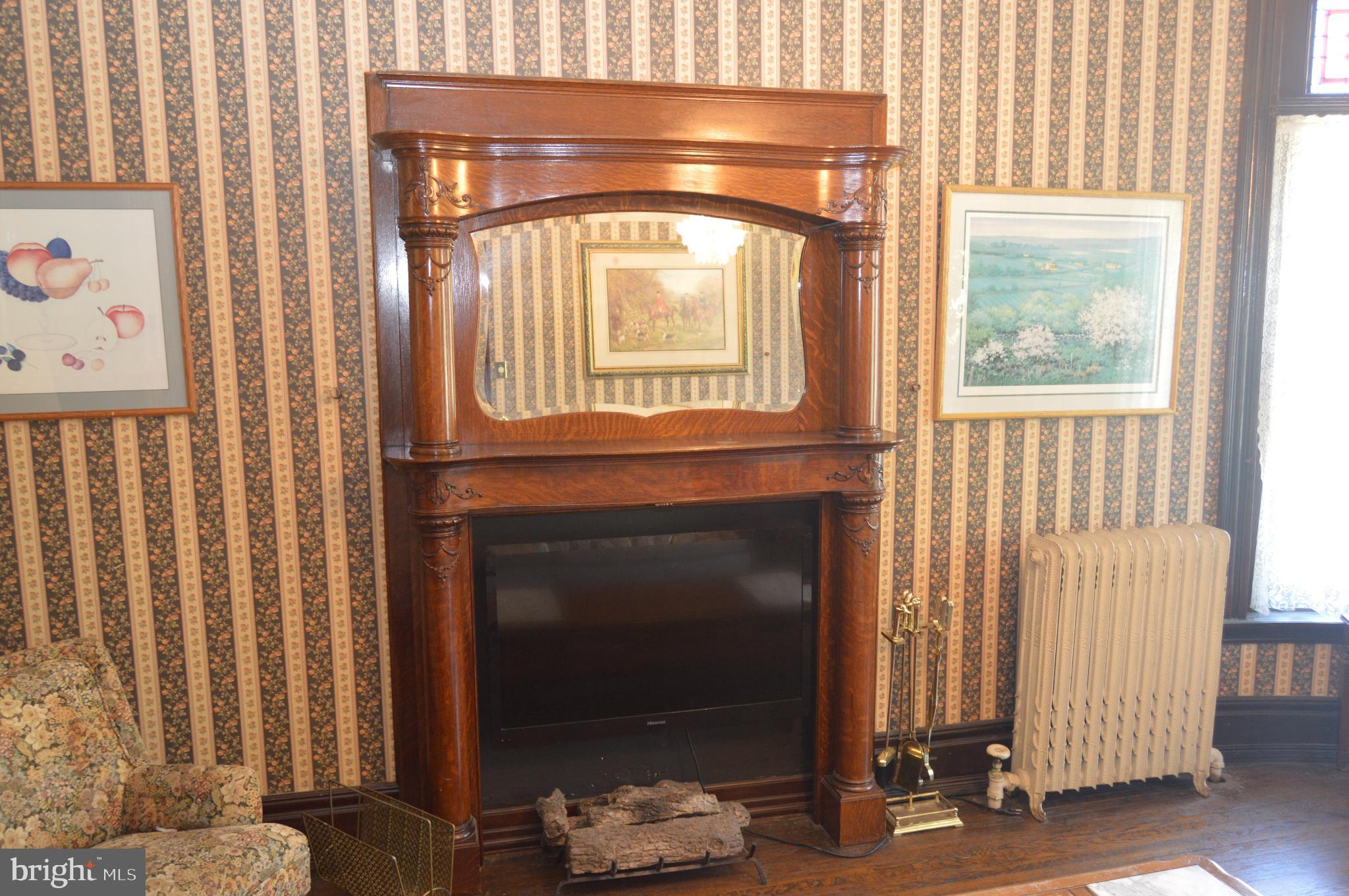 1536 Mineral Spring Road Reading, PA 19602 - Photo 20 of 61 a living room with furniture and a fireplace