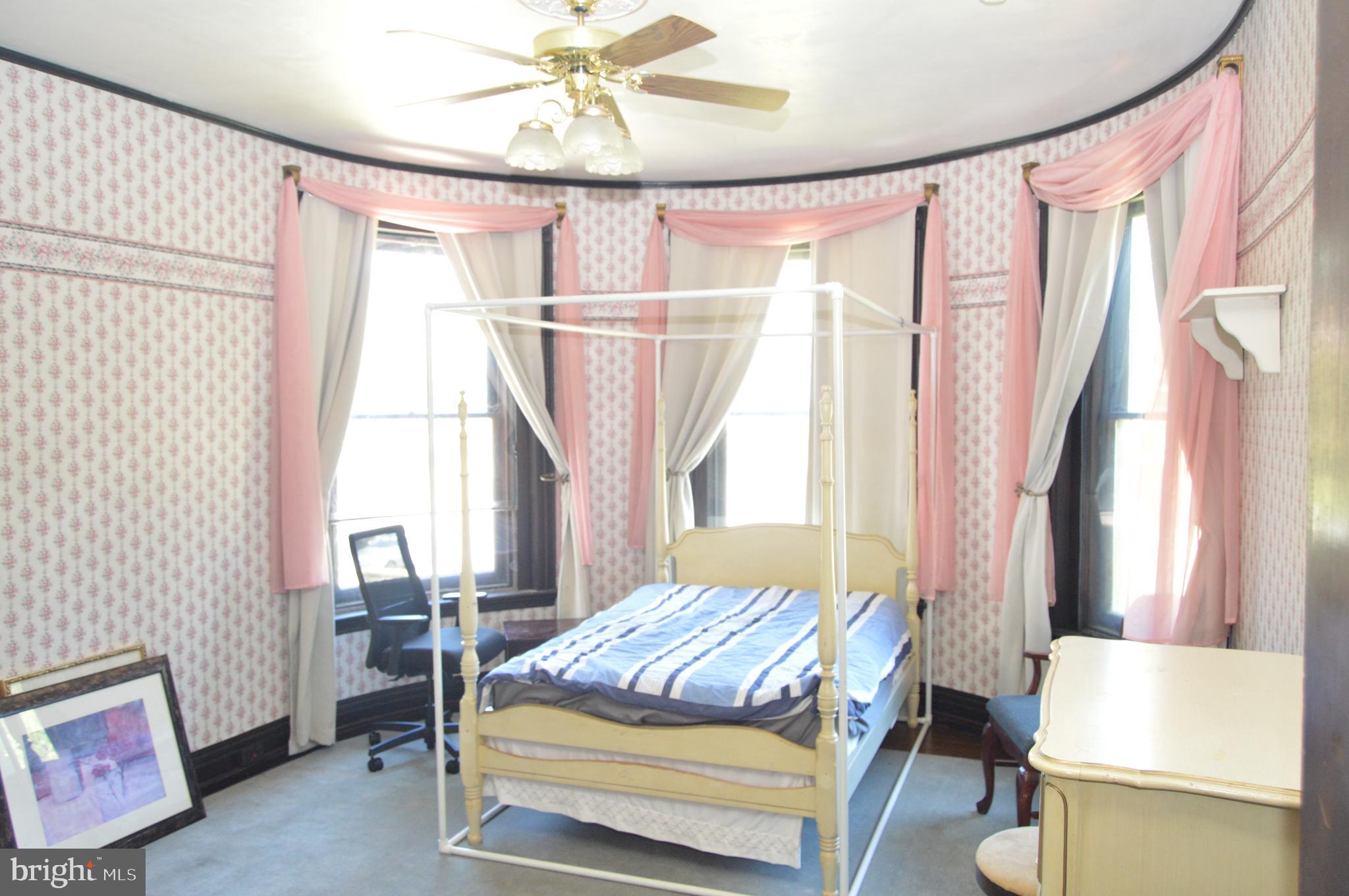 1536 Mineral Spring Road Reading, PA 19602 - Photo 36 of 61 a bedroom with a bed and a chandelier
