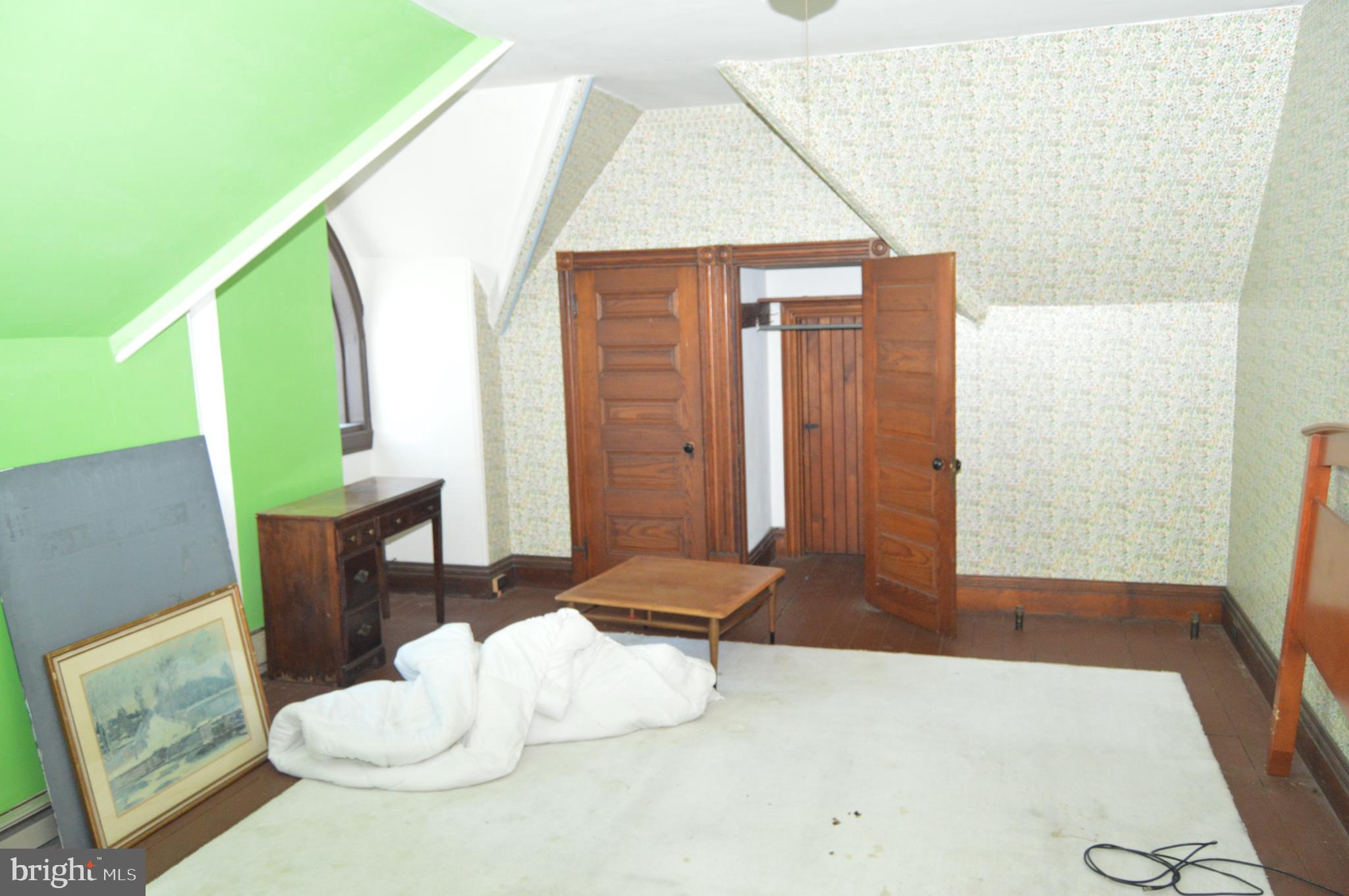 1536 Mineral Spring Road Reading, PA 19602 - Photo 44 of 61 a living room with furniture and a potted plant