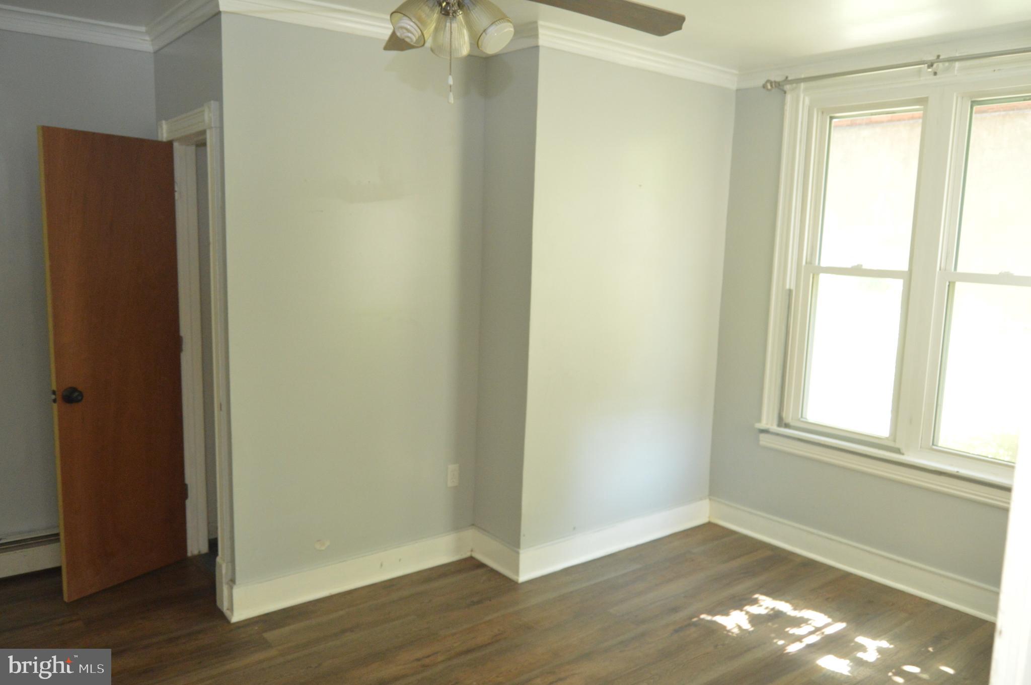 1536 Mineral Spring Road Reading, PA 19602 - Photo 54 of 61 a view of an empty room with wooden floor and a window