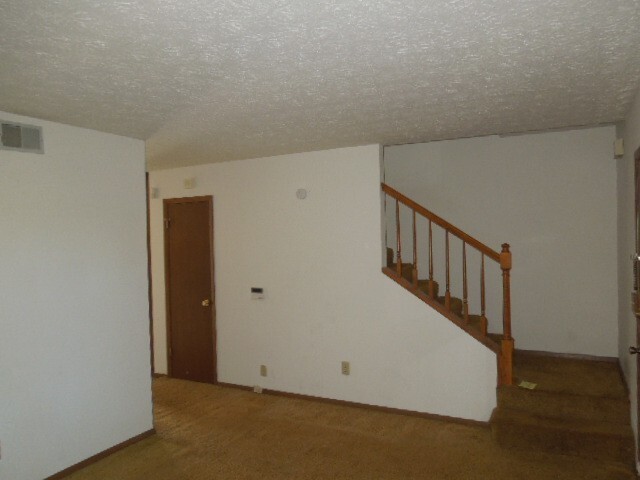 a view of a hallway with staircase