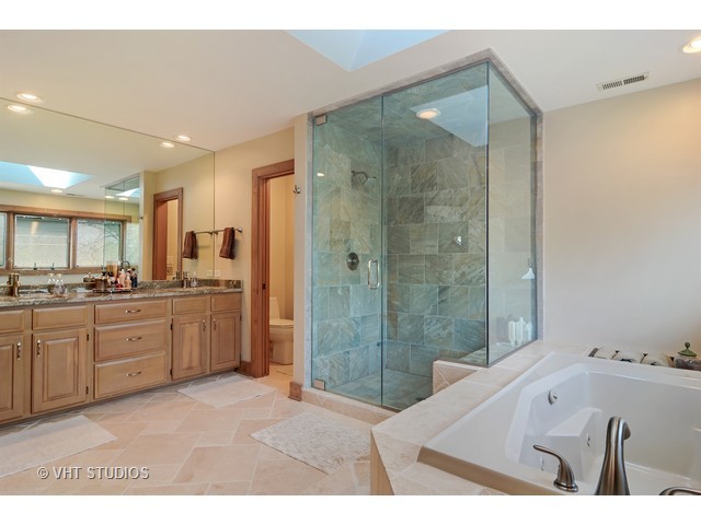 5727 Hampton Drive Long Grove, IL 60047 - Photo 13 of 25 a bathroom with a tub sink shower and mirror