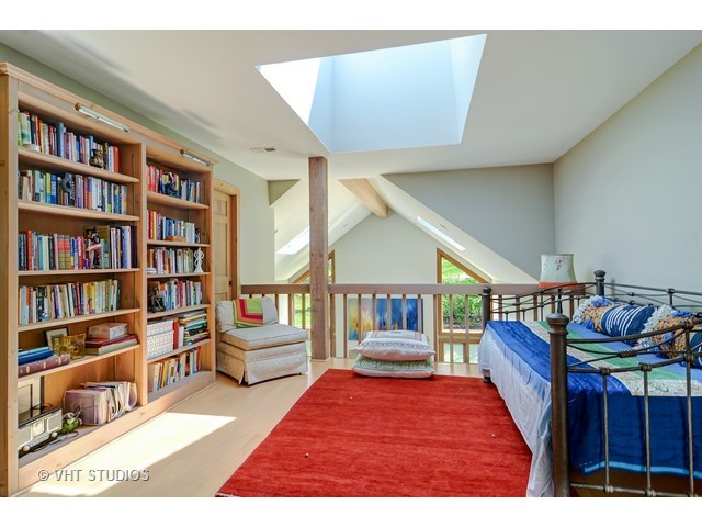 5727 Hampton Drive Long Grove, IL 60047 - Photo 14 of 25 a living room with furniture and a book shelf