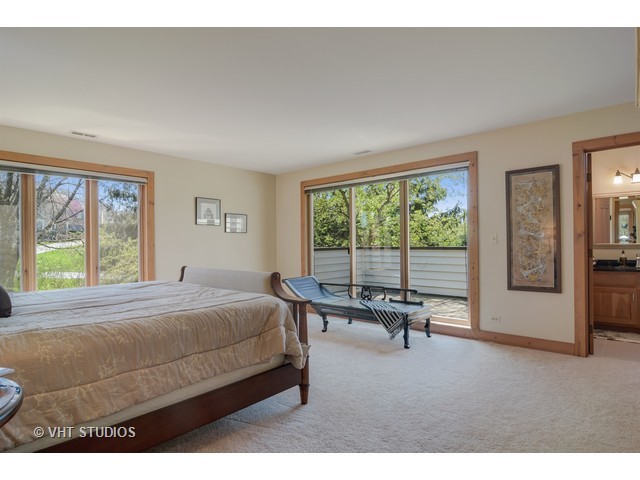 5727 Hampton Drive Long Grove, IL 60047 - Photo 15 of 25 a bed sitting in a bedroom next to a window