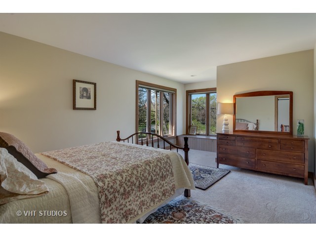 5727 Hampton Drive Long Grove, IL 60047 - Photo 17 of 25 a bed room with a bed and a large window