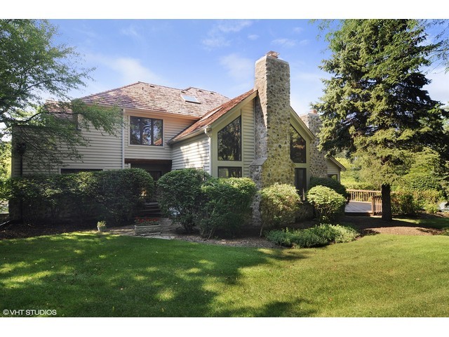 5727 Hampton Drive Long Grove, IL 60047 - Photo 24 of 25 a front view of a house with a garden