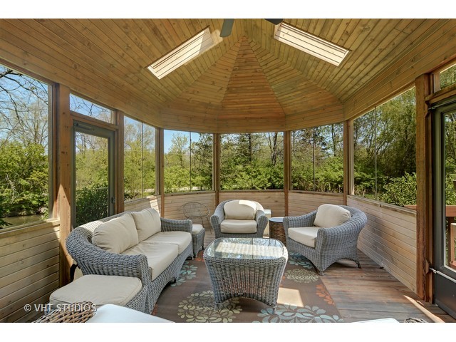 5727 Hampton Drive Long Grove, IL 60047 - Photo 10 of 25 a balcony with furniture and floor to ceiling window