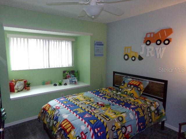 7630 Balharbour Drive New Port Richey, FL 34653 - Photo 11 of 17 a bedroom with a bed and a window