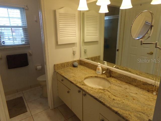 7630 Balharbour Drive New Port Richey, FL 34653 - Photo 12 of 17 a bathroom with a granite countertop sink and a mirror