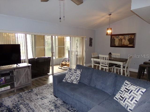 7630 Balharbour Drive New Port Richey, FL 34653 - Photo 14 of 17 a living room with furniture and a flat screen tv