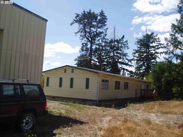 a view of a backyard of a house