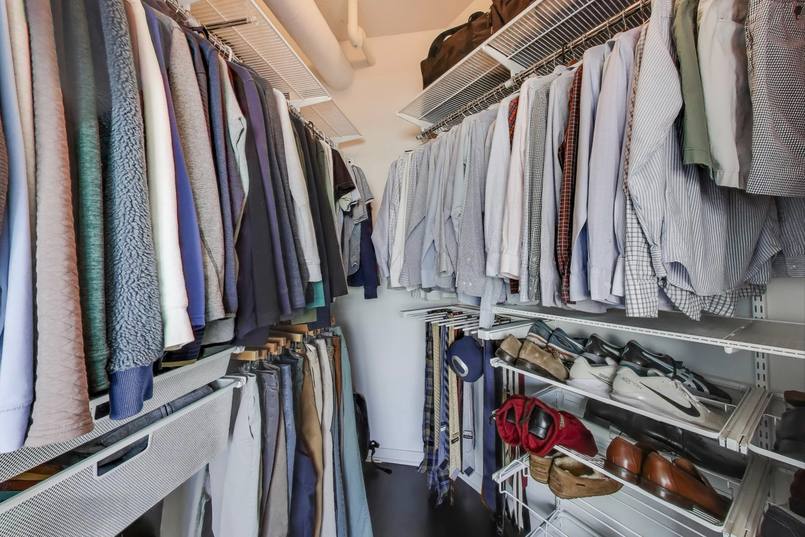 909 West Washington Boulevard, Unit 908 Chicago, IL 60607 - Photo 15 of 26 a view of walk in closet with clothes