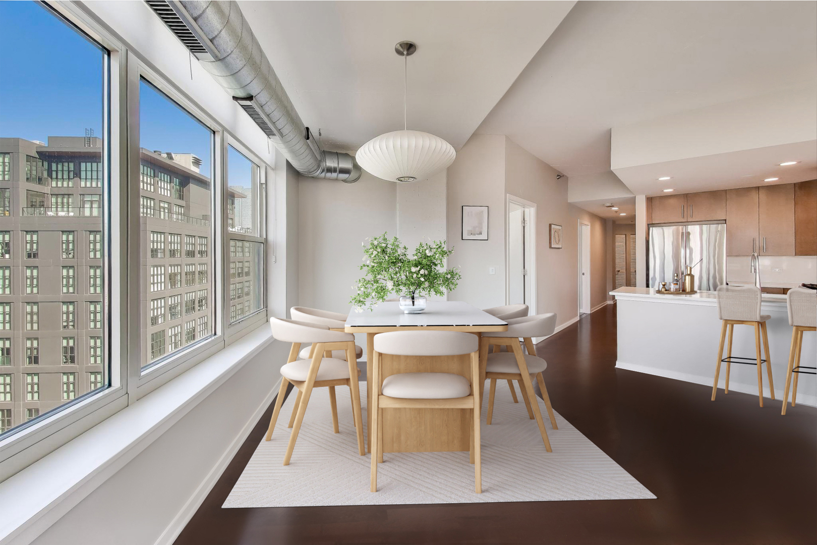 909 West Washington Boulevard, Unit 908 Chicago, IL 60607 - Photo 5 of 26 a view of a dining room with furniture window and wooden floor