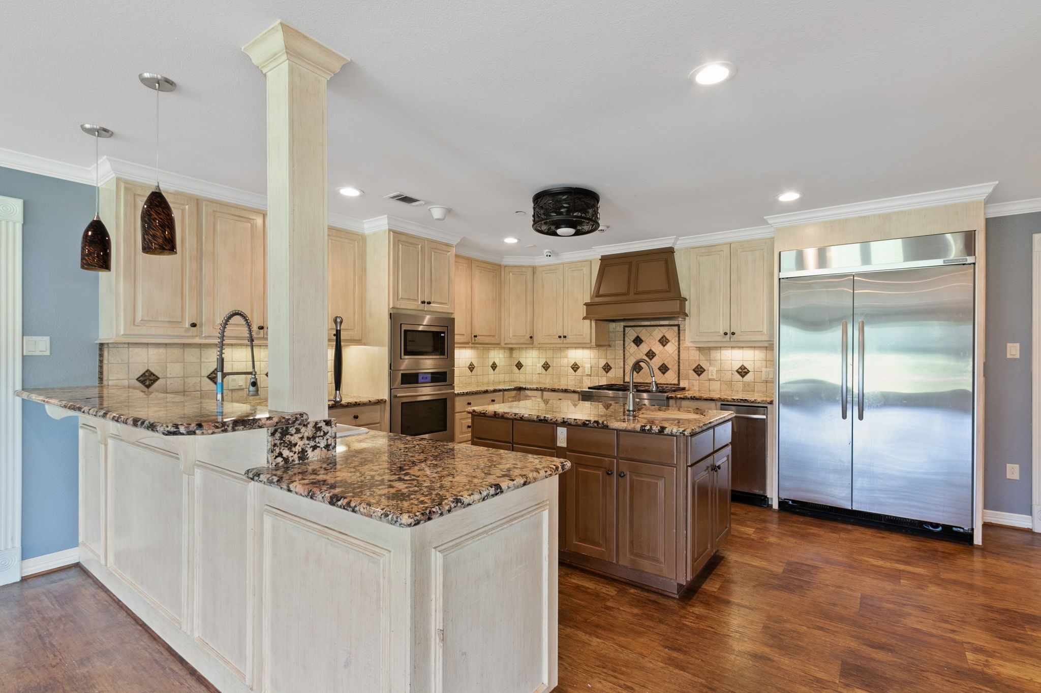 17018 Grant Road Cypress, TX 77429 - Photo 13 of 50 a kitchen with a sink and stove