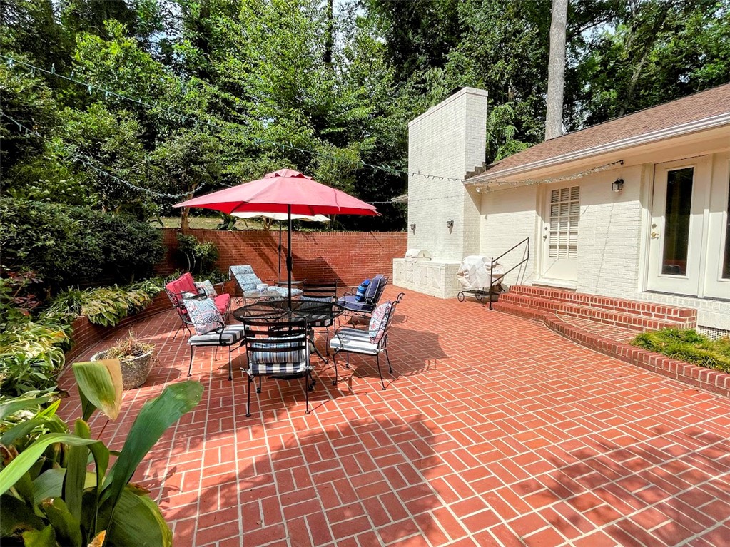 103 Poole Lane Clemson, SC 29631 - Photo 15 of 48 This outdoor living area includes a built in fireplace/BBQ area.