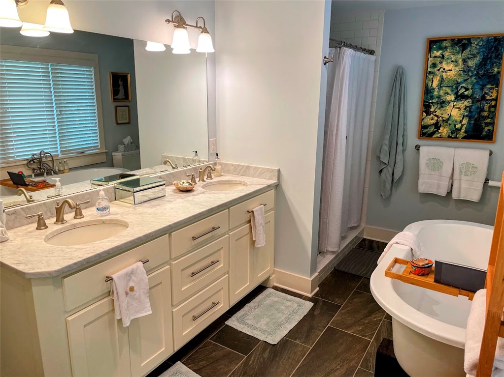 103 Poole Lane Clemson, SC 29631 - Photo 21 of 48 This bathroom offers Carrara Marble counter tops and custom built cabinets for plenty of storage.